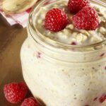 Overnight breakfast oats with raspberries in a mason jar