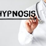 Doctor writing word HYPNOSIS with marker, Medical concept